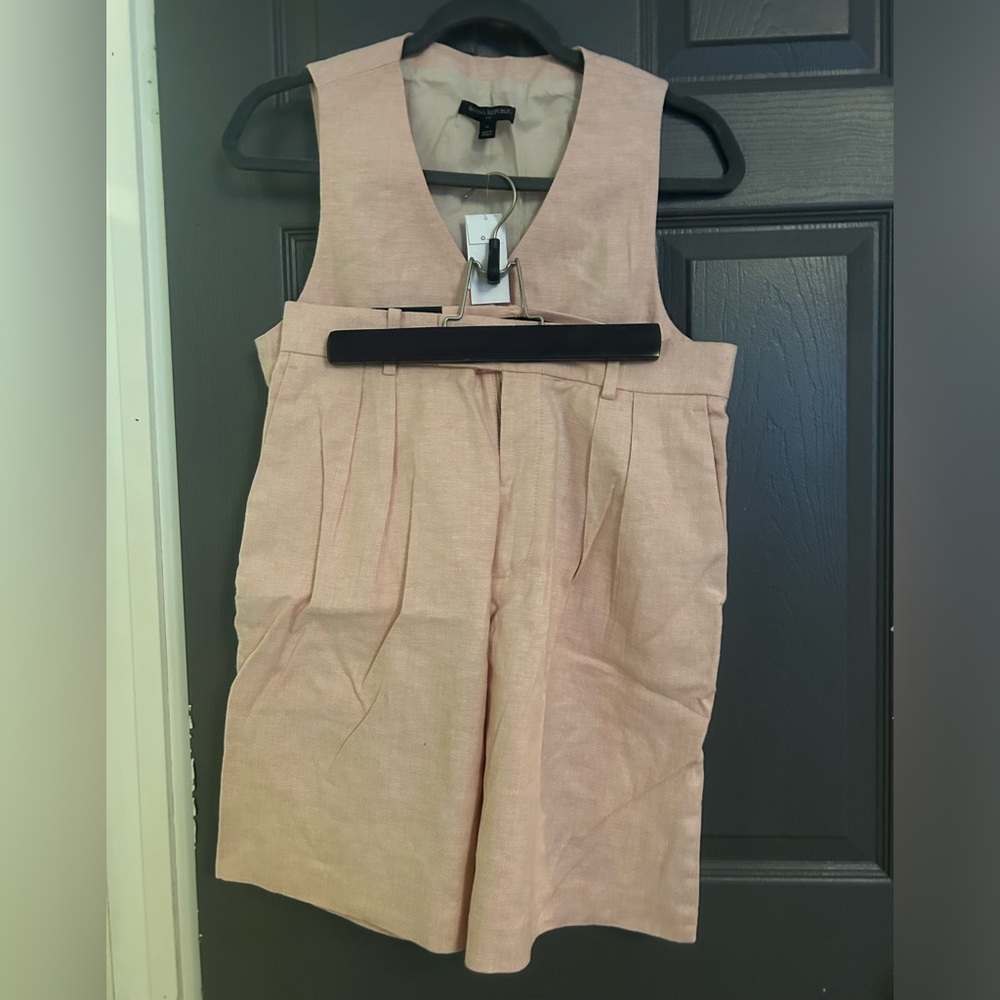 Pink vest and longer dress shorts. Never worn. Still have tags.